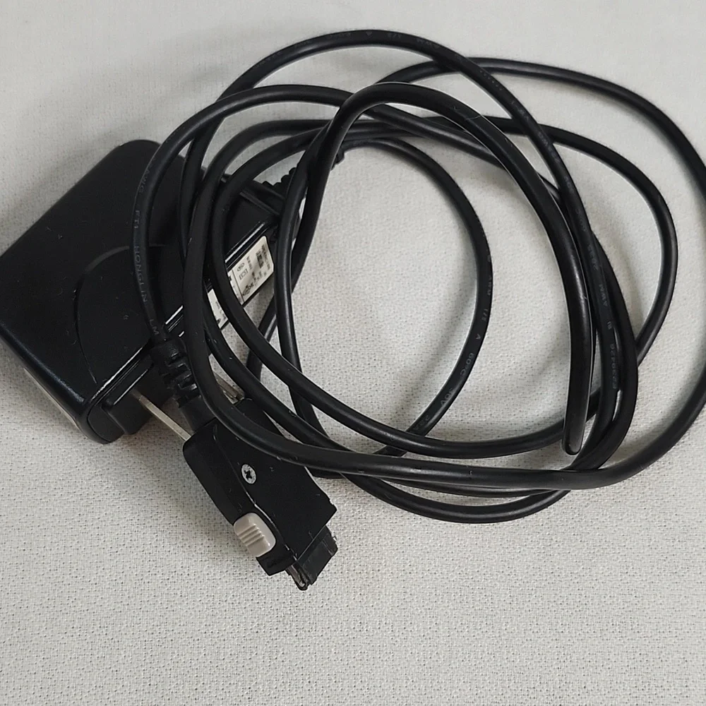 Assorted Vintage Electronic Charging Cables and Cases